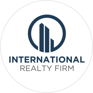 Logo of International Realty Firm featuring a circular design with buildings and text.